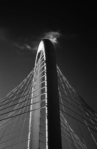 Low angle view of suspension bridge against sky
