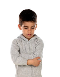 Portrait of boy standing against white background