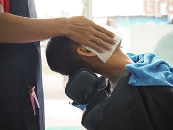 Close-up of man getting massage