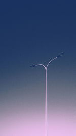 Low angle view of street light against clear blue sky