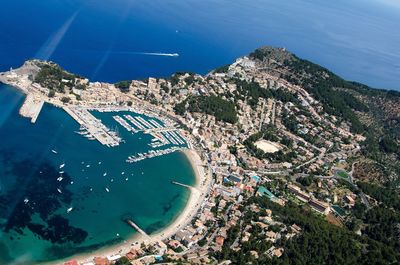 Aerial view of sea with mountains in background
