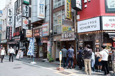 Group of people in front of building