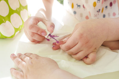 Cropped hands of doctor examining patient