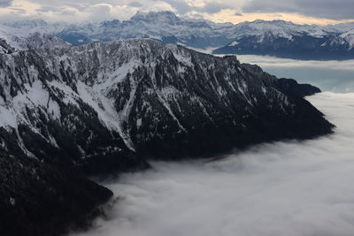 Scenic view of snowcapped mountains against sky