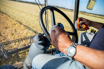 Midsection of man driving tractor