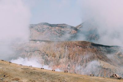 Smoke emitting from volcanic mountain