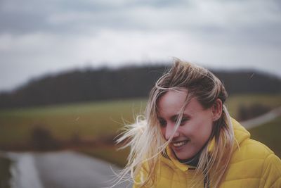 Portrait of woman smiling outdoors