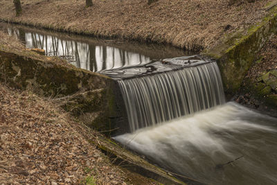 Blurred motion of dam by river