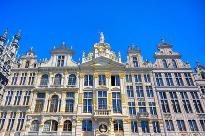 Low angle view of building against blue sky