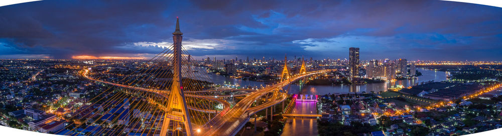 High angle view of city lit up at night