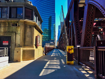 Street amidst buildings in city against sky