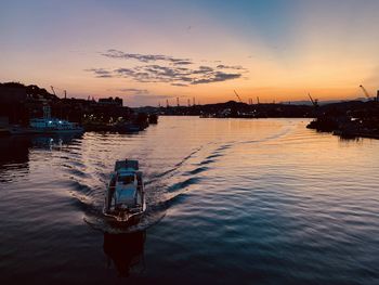 Scenic view of river against sky during sunset