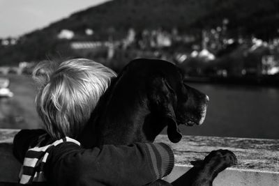 Close-up of dog with child