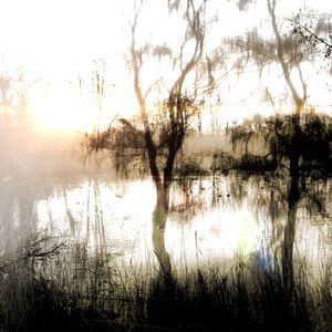 Scenic view of lake at sunset