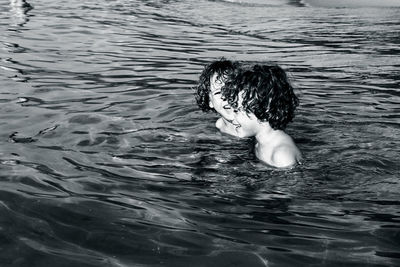 Happy children swimming in lake