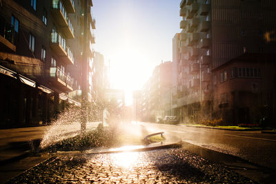 Water splashing on street in city