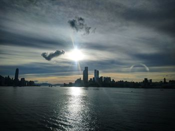 Scenic view of buildings against sky during sunset