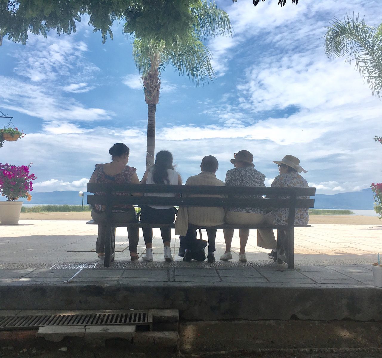 men, medium group of people, day, standing, sky, tree, outdoors, real people, togetherness, women, water, nature, adult, people