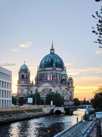 Berlin cathedral by spree river against sky