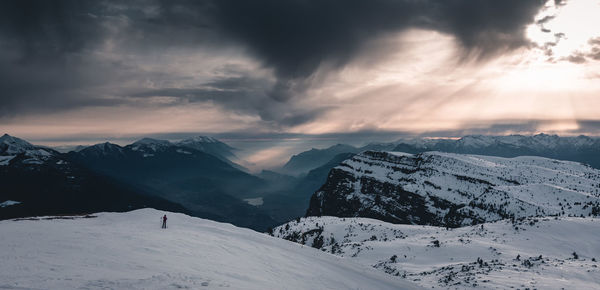 Scenic view of snowcapped mountains against sky