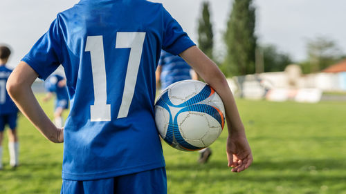 Full length of a boy holding ball