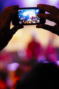 Man holding camera at home
