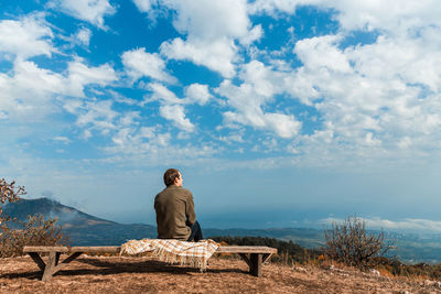 Man sitting on a rock