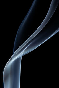 Close-up of smoke against black background