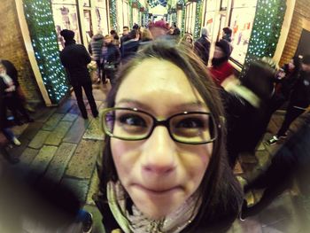 Portrait of woman standing in city