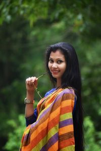 Portrait of smiling young woman outdoors