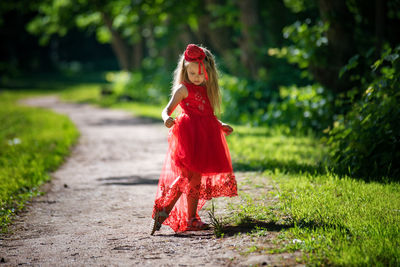 Portrait of young woman standing outdoors