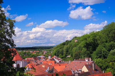 Houses against cloudy sky