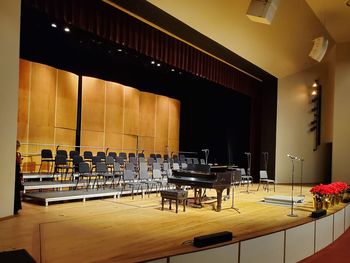 Empty chairs and tables in room