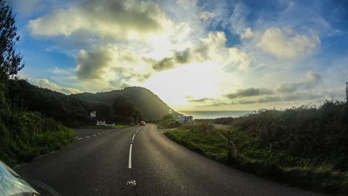 Empty road along landscape