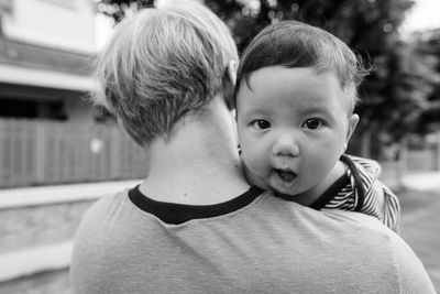 Portrait of son with father outdoors