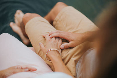 Midsection of couple kissing