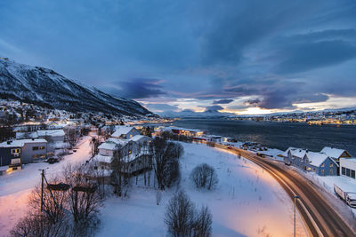 Scenic view of snow covered mountains against sky during sunset