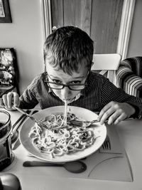 Midsection of boy on table