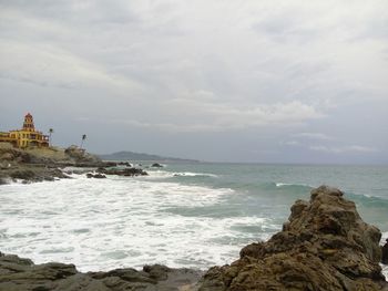 Scenic view of sea against cloudy sky