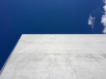 Low angle view of building against blue sky