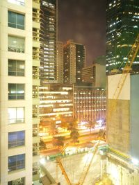 Buildings in city at night