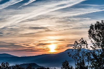 Scenic view of mountains against sky during sunset