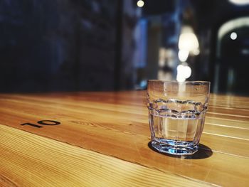 Close-up of beer glass on table