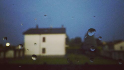 View of building through wet window