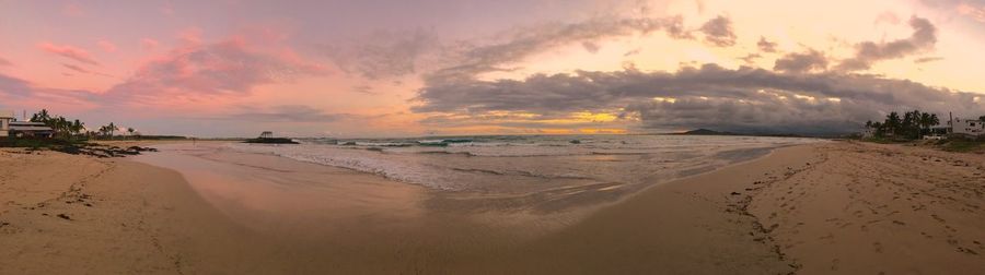 Panoramic view of beach against sky during sunset