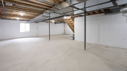 Renovated basement has been waterproofed and painted after repairs have been completed