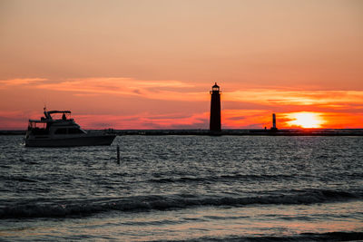 Scenic view of sea against orange sky