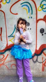 Portrait of boy holding umbrella