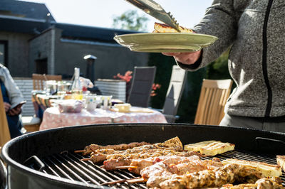 Midsection of man preparing food