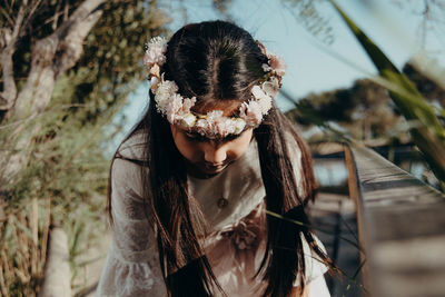 Close-up of girl wearing flower headband